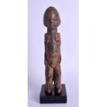 AN EARLY 20TH CENTURY AFRICAN CARVED HARDWOOD TRIBAL FERTILITY FIGURE modelled upon a square base. F