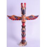 A NORTH AMERICAN CANADIAN PAINTED TOTEM POLE. 31 cm high.