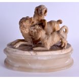 AN EARLY 18TH CENTURY ALABASTER SCULPTED GROUP OF DOGS English or Flanders C1720, modelled upon a la