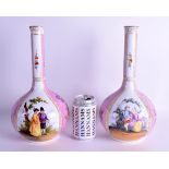 A LARGE PAIR OF 19TH CENTURY GERMAN DRESDEN PORCEAIN BOTTLE VASES painted with figures within landsc