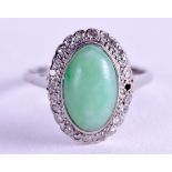 AN EARLY 20TH CENTURY CHINESE PLATINUM DIAMOND AND JADEITE RING. 4 grams. Jadeite 0.75 cm x 1 cm.