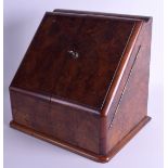 A LATE VICTORIAN BURR WALNUT STATIONARY DESK CABINET the doors opening to reveal a fitted interior,