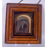 A FRAMED VICTORIAN DAGUERREOTYPE, depicting a seated female. 9 cm x 7 cm.