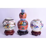 AN EARY 20TH CENTURY JAPANESE MEIJI PERIOD PORCELAIN SAKE BOTTLE together with two Chinese ginger ja