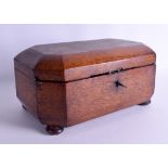 AN UNUSUAL 19TH CENTURY OAK TWIN DIVISION TEA CADDY of octagonal form, with glass caddy. 32 cm wide.