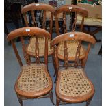 A SET OF FOUR ANTIQUE WOODEN CHAIRS.