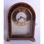 AN EARLY 20TH CENTURY BRONZE AND TORTOISESHELL MANTEL CLOCK with arch top and silvered dial. 27 cm x