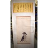 A GOOD CHINESE SCROLL wonderfully decorated with a fine seated hound under bandings of calligraphy.