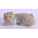 A 19TH CENTURY CHINESE GREEN MUTTON JADE FIGURE OF A BEAST modelled recumbent 8 cm x 3.5 cm.