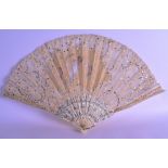 AN EARLY 20TH CENTURY FRENCH LACE AND SILK FAN painted with three figures. 44 cm wide.