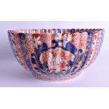 A LARGE EARLY 19TH CENTURY JAPANESE EDO PERIOD IMARI SCALLOPED BOWL painted with figures within diff