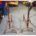 A STYLISH PAIR OF AESTHETIC MOVEMENT CAST IRON ANDIRONS, formed with swirling top and hanging ring.