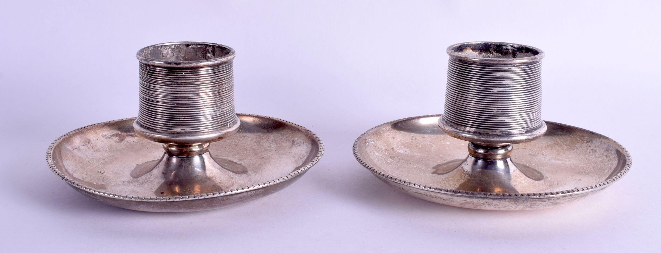 A PAIR OF LATE VICTORIAN/EDWARDIAN SILVER CANDLESTICKS. London (date letter rubbed). 15 oz. 12 cm wi