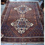 AN ANTIQUE PERSIAN AFSHAR RUG, decorated with foliage and motifs, signed. 183 cm x 150 cm.