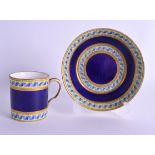 AN 18TH CENTURY SEVRES PORCELAIN COFFEE CAN AND SAUCER painted with blue ribbons. (2)