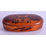 A 19TH CENTURY MIDDLE EASTERN ISLAMIC SNUFF BOX decorated with kufic script. 10 cm x 5.5 cm.