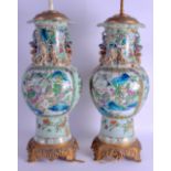 A GOOD PAIR OF 19TH CENTURY CHINESE CANTON FAMILLE ROSE CELADON VASES converted to lamps, painted wi