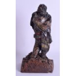 A RARE 18TH CENTURY PAINTED TERRACOTTA FIGURE OF A MALE modelled upon a carved wood base. 27 cm high