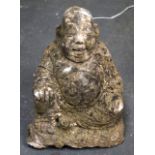 A MODERN CONCRETE BUDDHA, modelled seated. 32 cm high.