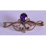 AN EDWARDIAN 9CT GOLD AMETHYST AND DIAMOND BROOCH. 3 grams.