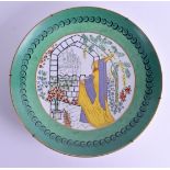 A RARE ART DECO CZECH PORCELAIN CHARGER depicting a female walking before a castle. 31 cm diameter.