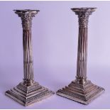 A PAIR OF SILVER CORINTHIAN COLUMN CANDLESTICKS. Sheffield 1902. 34 oz (weighted). 25 cm high.