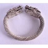 A CHINESE WHITE METAL DRAGON BANGLE. 125 grams. 10 cm wide.