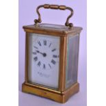 A BRASS CARRIAGE CLOCK. 14 cm high inc handle.