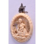 A 19TH CENTURY CONTINENTAL CARVED IVORY PENDANT. 4.5 cm x 6.5 cm.