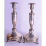 A PAIR OF 19TH CENTURY CONTINENTAL SILVER CANDLESTICKS decorated with neo classical motifs. 47.4 oz.