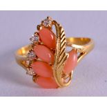 A GOLD DIAMOND AND CORAL RING. Size Q.