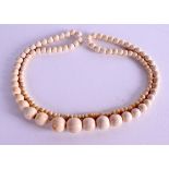 AN EARLY 20TH CENTURY CARVED IVORY NECKLACE. 48 grams. 78 cm long.