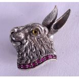 A SILVER AND RUBY HARE BROOCH. 3.5 cm wide.