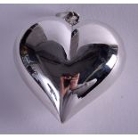 A LARGE SILVER HEART PENDANT.