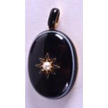 A VICTORIAN GOLD AGATE AND PEARL MOURNING LOCKET. 2.5 cm x 4.5 cm.