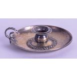 A SMALL ANTIQUE CHAMBERSTICK. 5.75 cm wide.
