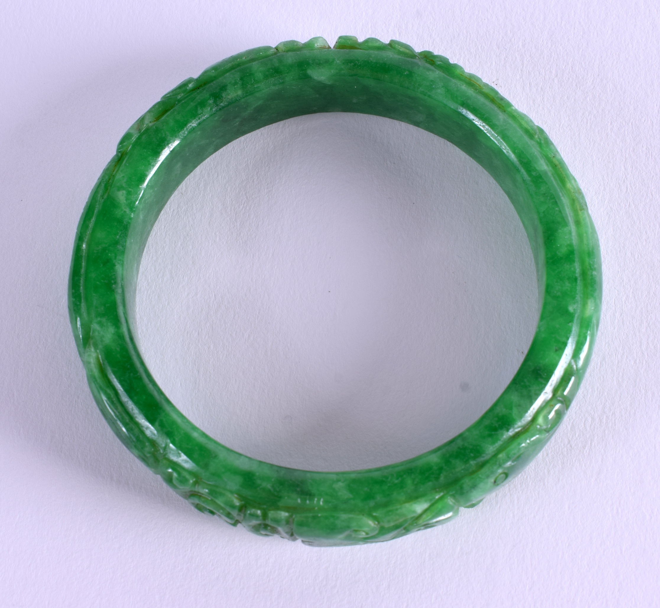 A CHINESE CARVED JADEITE BANGLE. 7.25 cm wide. - Image 3 of 3