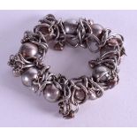 A VINTAGE HEAVY SILVER BRACELET. 8.5 cm wide.