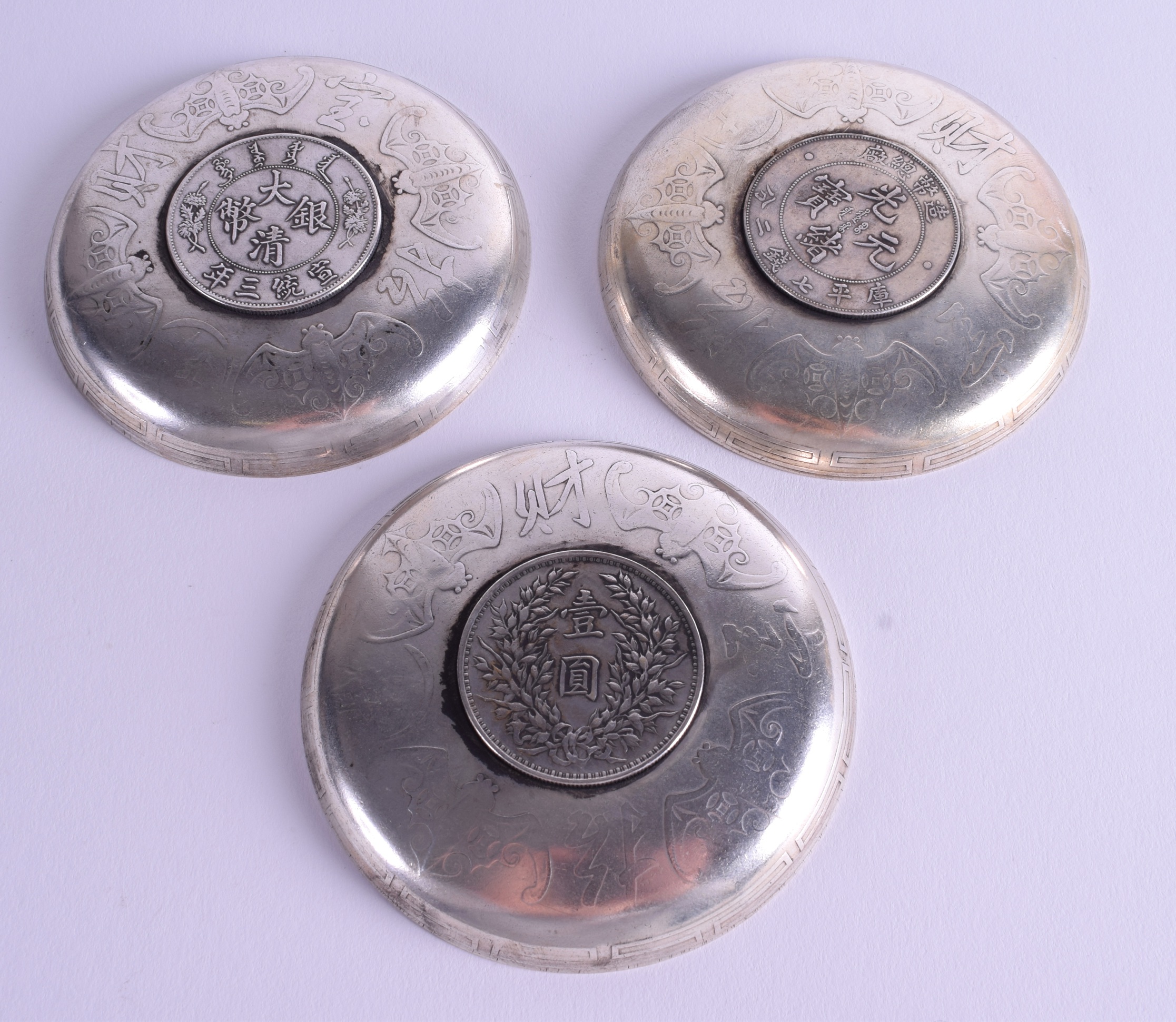 THREE CHINESE WHITE METAL COIN DISHES. 9 cm wide. (3) - Image 2 of 2