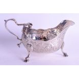 AN ANTIQUE IRISH SILVER SAUCEBOAT engraved with foliage. 6.3 oz. 15 cm wide.