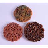 THREE CHINESE CARVED HARDSTONE DISCS. 6.5 cm wide. (3)
