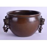 A CHINESE BRONZE CENSER with buddhistic mask head handles. 10 cm x 7 cm.