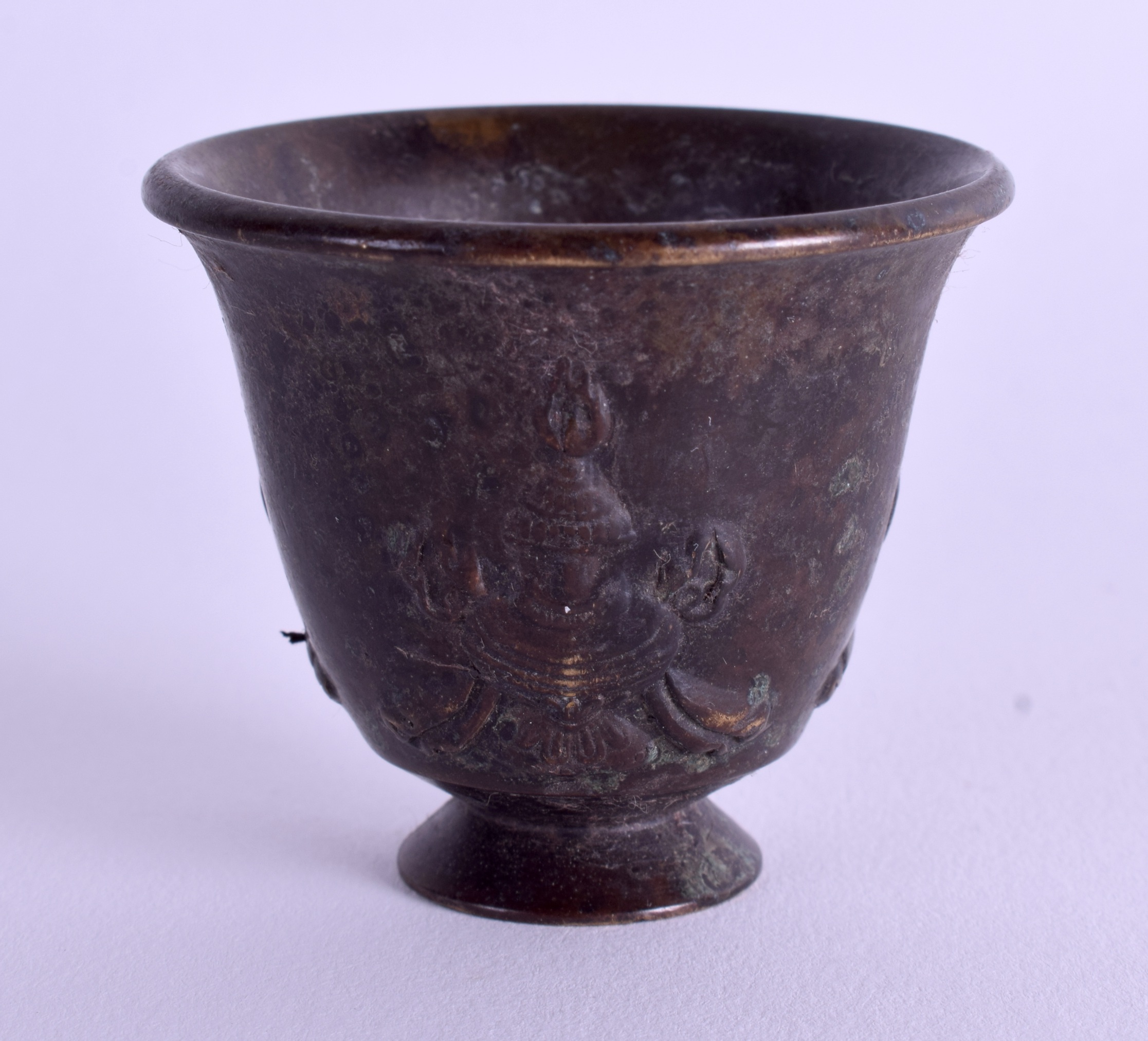 A CHINESE TIBETAN BRONZE CUP. 4.5 cm high.