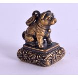 A BRASS DOG SEAL. 3.75 cm high.