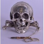 A RARE 19TH CENTURY SILVER SKULL CLOCK the mouth opening to reveal the movement. 8 cm x 6 cm.