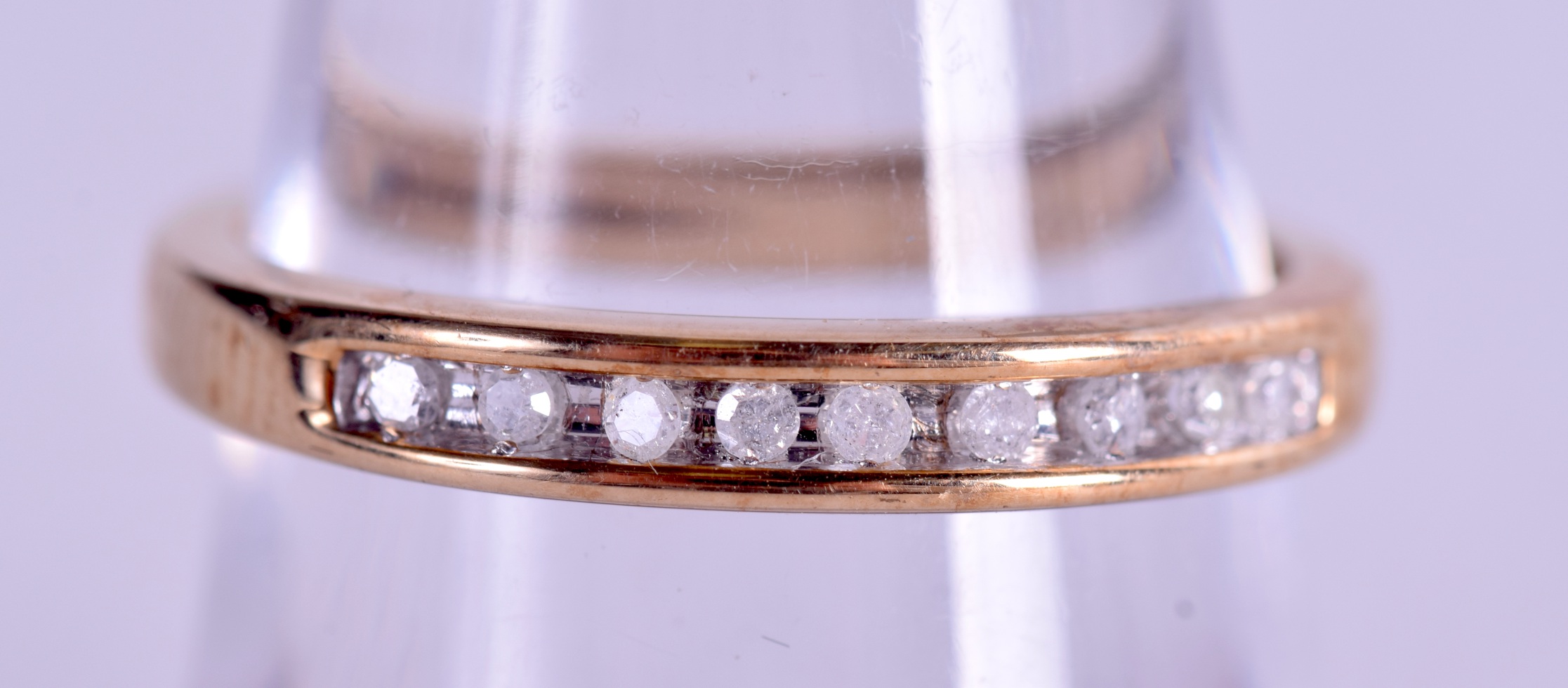 A 9CT GOLD MULTI STONE DIAMOND RING. Size P.
