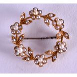 A VICTORIAN 15CT GOLD AND PEARL BROOCH. 3.9 grams. 2.25 cm wide.