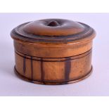 A VICTORIAN CARVED TREEN SNUFF BOX AND COVER. 6.75 cm diameter.