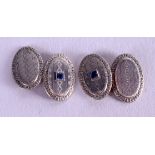 A PAIR OF ART DECO GOLD SILVER AND SAPPHIRE CUFFLINKS. 4.8 grams.