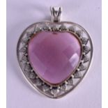 A SILVER HEART PENDANT.